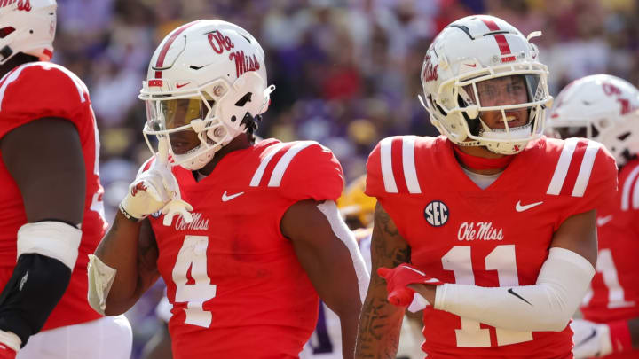 Oct 22, 2022; Baton Rouge, Louisiana, USA; Mississippi Rebels running back Quinshon Judkins (4) and Mississippi Rebels wide receiver Jordan Watkins (11) react to a making a touchdown against the LSU Tigers during the first half at Tiger Stadium. Mandatory Credit: Stephen Lew-USA TODAY Sports
