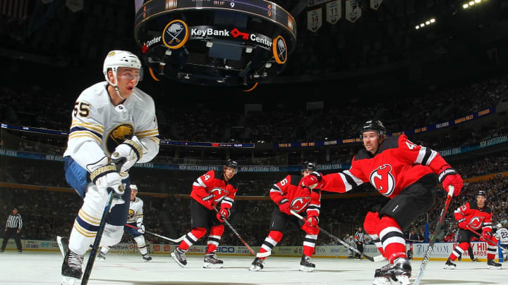 BUFFALO, NY – OCTOBER 5: Rasmus Ristolainen #55 of the Buffalo Sabres controls the pucks against Sami Vatanen #45 of the New Jersey Devils during an NHL game on October 5, 2019 at KeyBank Center in Buffalo, New York. (Photo by Bill Wippert/NHLI via Getty Images)