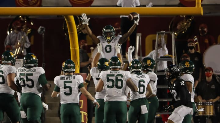 AMES, IA – NOVEMBER 7: Wide receiver R.J. Sneed #0 of the Baylor Bears celebrates with teammates after scoring a touchdown in the first half of the play against the Iowa State Cyclones at Jack Trice Stadium on November 7, 2020 in Ames, Iowa. (Photo by David Purdy/Getty Images)