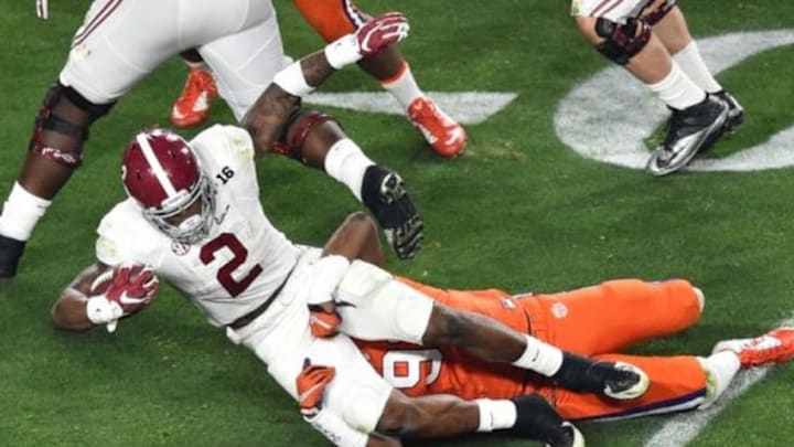 Jan 11, 2016; Glendale, AZ, USA; Alabama Crimson Tide running back Derrick Henry (2) is brought down by Clemson Tigers defensive end Shaq Lawson (90) during the first quarter in the 2016 CFP National Championship at University of Phoenix Stadium. Mandatory Credit: Gary A. Vasquez-USA TODAY Sports