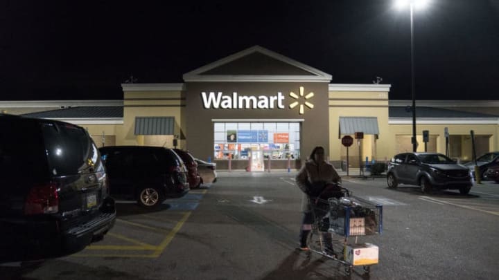 KING OF PRUSSIA, PA - NOVEMBER 28: A woman leaves Walmart on Thanksgiving night ahead of Black Friday on November 28, 2019 in King of Prussia, United States. (Photo by Sarah Silbiger/Getty Images)