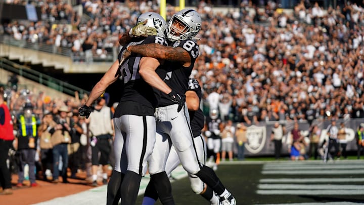 OAKLAND, CALIFORNIA – NOVEMBER 17: Foster Moreau #87 celebrates catching a touchdown pass with Darren Waller #83 of the Oakland Raiders during the first half against the Cincinnati Bengals at RingCentral Coliseum on November 17, 2019 in Oakland, California. (Photo by Daniel Shirey/Getty Images)