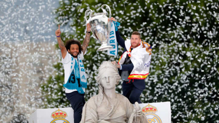 MADRID, SPAIN - MAY 27: Marcelo of Real Madrid and Sergio Ramos of Real Madrid celebrate with the trophy after winning yesterday's Uefa Champions League Final match at Cibeles Square on May 27, 2018 in Madrid, Spain. (Photo by TF-Images/Getty Images)