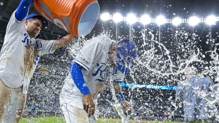 Nicky Lopez #1 of the Kansas City Royals gets the victory shower from Whit Merrifield (Photo by John Sleezer/Getty Images)