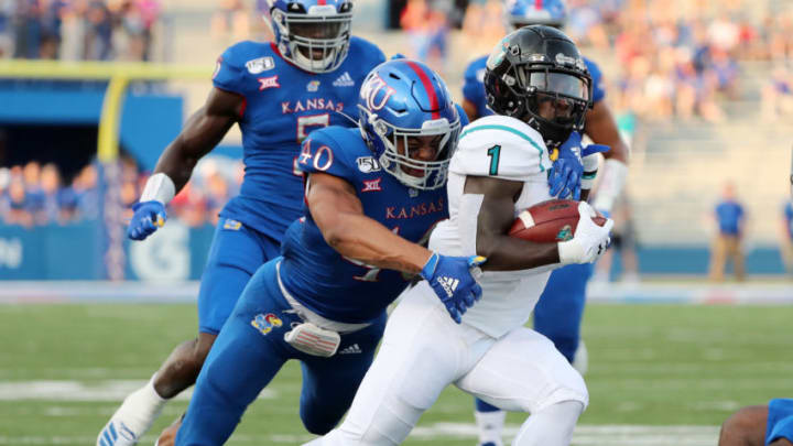 Coastal Carolina running back CJ Marable is tackled by Kansas football linebacker Dru Prox. Mandatory Credit: Jay Biggerstaff-USA TODAY Sports