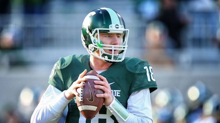 Nov 28, 2015; East Lansing, MI, USA; Michigan State Spartans quarterback Connor Cook (18) warms up prior to a game against the Penn State Nittany Lions at Spartan Stadium. Mandatory Credit: Mike Carter-USA TODAY Sports