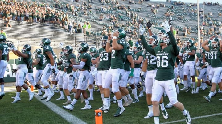 Sep 2, 2016; East Lansing, MI, USA;The Michigan State Spartans take the field before a game against the Furman Paladins at Spartan Stadium. Mandatory Credit: Mike Carter-USA TODAY Sports