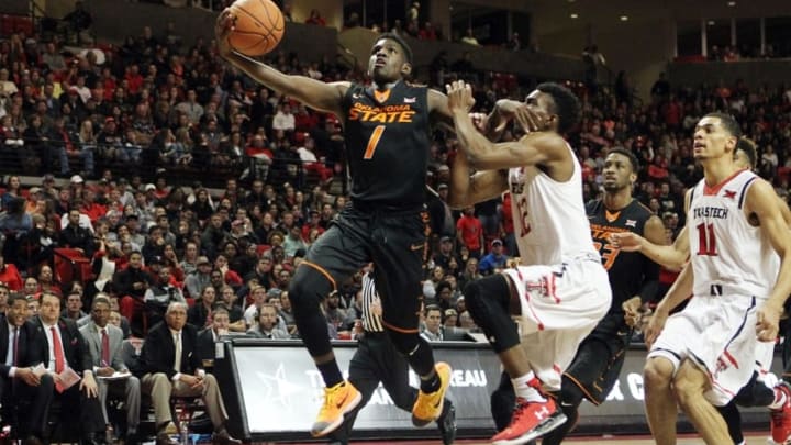 Feb 3, 2016; Lubbock, TX, USA; Oklahoma State Cowboys guard Jawun Evans (1) is fouled by Texas Tech Red Raiders guard Keenan Evans (12) in the first half at United Supermarkets Arena. Mandatory Credit: Michael C. Johnson-USA TODAY Sports