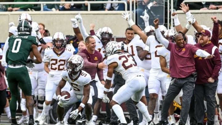 Minnesota's Justin Walley, center, and the bench celebrate after Walley's interception against Michigan State during the second quarter on Saturday, Sept. 24, 2022, at Spartan Stadium in East Lansing.220924 Msu Minn Fb 091a