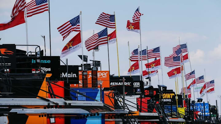 May 26, 2016; Concord, NC, USA; American and Patriotic flags fly over haulers during qualifying for the Coca-Cola 600 at Charlotte Motor Speedway. Mandatory Credit: Jim Dedmon-USA TODAY Sports