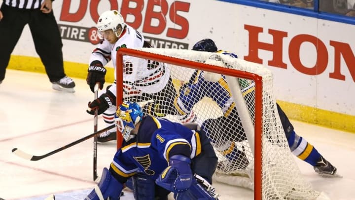 Apr 21, 2016; St. Louis, MO, USA; Chicago Blackhawks right wing Patrick Kane (88) wraps a shot around the back of the net against St. Louis Blues goalie Brian Elliott (1) during the second overtime period in game five of the first round of the 2016 Stanley Cup Playoffs at Scottrade Center. The Blackhawks won the game 4-3 in double overtime. Mandatory Credit: Billy Hurst-USA TODAY Sports