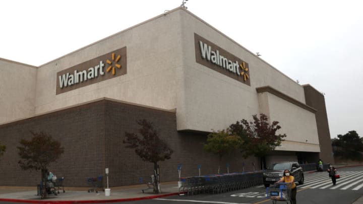 RICHMOND, CALIFORNIA - SEPTEMBER 03: Customers leave a Walmart store on September 03, 2020 in Richmond, California. Walmart has announced plans to launch Walmart Plus delivery service to compete with Amazon Prime. The $98 per year service will offer free delivery of food and items available from nearby stores. (Photo by Justin Sullivan/Getty Images)