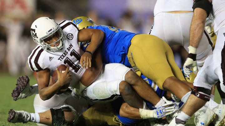 PASADENA, CA – SEPTEMBER 03: Kellen Mond #11 of the Texas A&M Aggies is sacked by Jacob Tuioti-Mariner #91 of the UCLA Bruins during the second half of a game at the Rose Bowl on September 3, 2017 in Pasadena, California. (Photo by Sean M. Haffey/Getty Images)