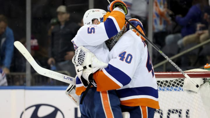Apr 1, 2022; New York, New York, USA; New York Islanders goaltender Semyon Varlamov (40) celebrates with center Casey Cizikas (53) after shutting out the New York Rangers 3-0 at Madison Square Garden. Mandatory Credit: Brad Penner-USA TODAY Sports