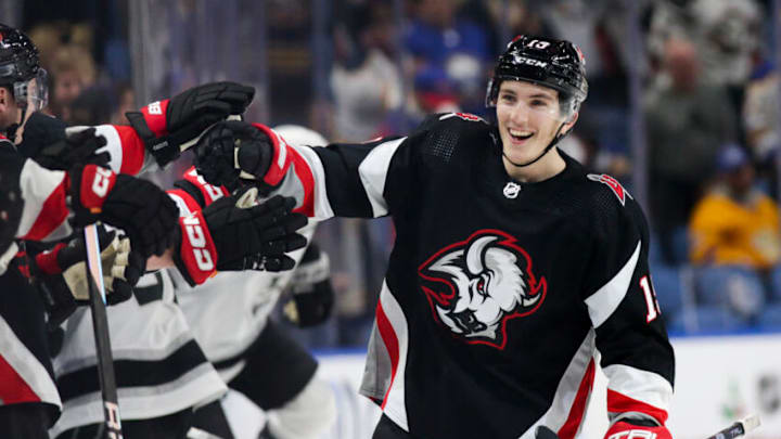 BUFFALO, NEW YORK - DECEMBER 13: Peyton Krebs #19 of the Buffalo Sabres celebrates after scoring a goal during the third period of an NHL hockey game against the Los Angeles Kings at KeyBank Center on December 13, 2022 in Buffalo, New York. (Photo by Joshua Bessex/Getty Images)