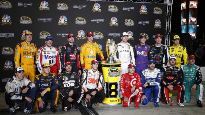 Sep 10, 2016; Richmond, VA, USA; Sprint Cup Series drivers pose for a photo with the chase trophy after the Federated Auto Parts 400 at Richmond International Raceway. Mandatory Credit: Amber Searls-USA TODAY Sports
