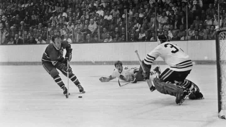 (Original Caption) Montreal's veteran Henri Richard cracks a drive past Chicago Black Hawks' goalie Tony Esposito in the third period of seventh Stanley Cup game here May 18th. Keith Magnuson of the Hawks looks. Richard's goal gave the Canadiens a 3-2 lead which they kept to win the coveted Cup for the 17th time in team history.