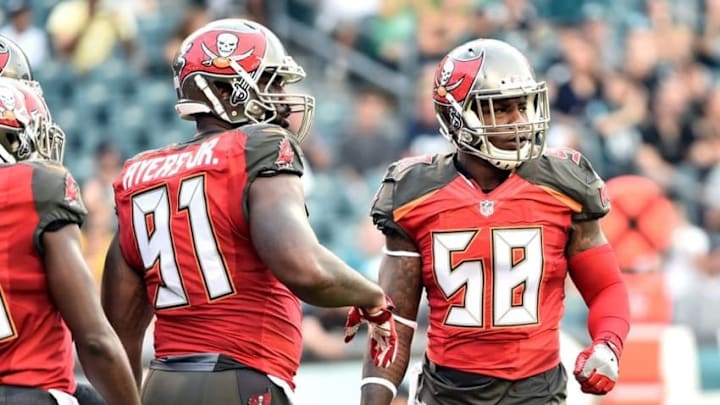 Aug 11, 2016; Philadelphia, PA, USA; Tampa Bay Buccaneers linebacker Robert Ayers (91) and middle linebacker Kwon Alexander (58) get signals from the sidelines against the Philadelphia Eagles at Lincoln Financial Field. The Eagles defeated the Buccaneers, 17-9. Mandatory Credit: Eric Hartline-USA TODAY Sports