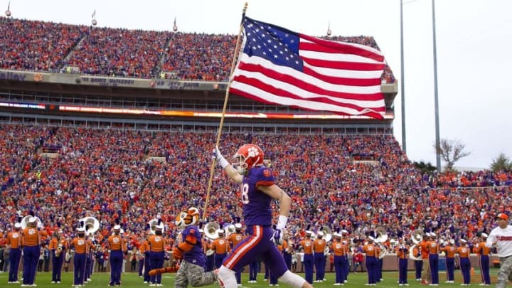 Nov 21, 2015; Clemson, SC, USA; Clemson Tigers wide receiver Sean Mac Lain (88) carries the American flag prior to the game against the Wake Forest Demon Deacons at Clemson Memorial Stadium. Mandatory Credit: Joshua S. Kelly-USA TODAY Sports