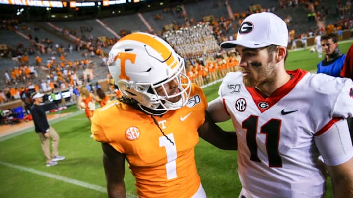 KNOXVILLE, TENNESSEE - OCTOBER 05: Jake Fromm #11 of the Georgia Bulldogs talks with Marquez Callaway #1 of the Tennessee Volunteers on the field after the game at Neyland Stadium on October 05, 2019 in Knoxville, Tennessee. (Photo by Silas Walker/Getty Images)