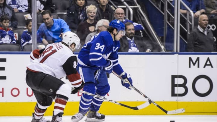 TORONTO, ON - FEBRUARY 11: Auston Matthews #34 of the Toronto Maple Leafs plays the puck against Phil Kessel #81 of the Arizona Coyotes during the first period at the Scotiabank Arena on February 11, 2020 in Toronto, Ontario, Canada. (Photo by Andrew Lahodynskyj/NHLI via Getty Images)