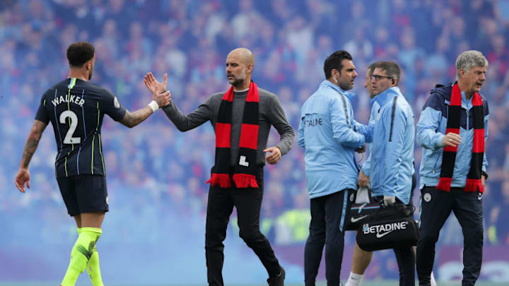 LONDON, ENGLAND - MARCH 30: Josep Guardiola, Manager of Manchester City congratulates Kyle Walker of Manchester City following the Premier League match between Fulham FC and Manchester City at Craven Cottage on March 30, 2019 in London, United Kingdom. (Photo by Richard Heathcote/Getty Images)