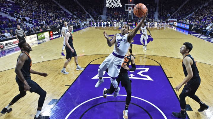 MANHATTAN, KS - JANUARY 10: Barry Brown #5 of the Kansas State Wildcats drives and scores a basket against the Oklahoma State Cowboys during the first half on January 10, 2018 at Bramlage Coliseum in Manhattan, Kansas. (Photo by Peter G. Aiken/Getty Images)
