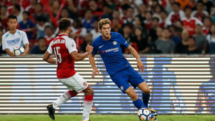 BEIJING, CHINA - JULY 22: Marco Alonso of Chelsea dribbles against Oxlade Chamberlain of Arsenal during the Pre-Season Friendly match between Arsenal FC and Chelsea FC at Birds Nest on July 22, 2017 in Beijing, China. (Photo by Yifan Ding/Getty Images )