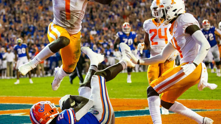 Florida Gators tight end Kemore Gamble (2) hauls in a touchdown pass from Florida Gators wide receiver Trent Whittemore (14) in the second half to make it 24-14 as Tennessee Volunteers defensive back Trevon Flowers (1) leaps over him. The Florida Gators played the Tennessee Volunteers Saturday September 25, 2021 at Ben Hill Griffin Stadium in Gainesville, FL. [Doug Engle/GainesvilleSun]2021Flgai 092521 Gatorsvsvolsgatorwalk