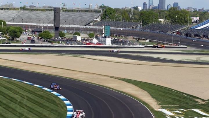 INDIANAPOLIS, IN - MAY 10: Cars drive on the track with the city skyline during the Grand Prix of Indianapolis at Indianapolis Motorspeedway on May 10, 2014 in Indianapolis, Indiana. (Photo by Andy Lyons/Getty Images)