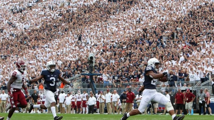 Sep 17, 2016; University Park, PA, USA; Penn State Nittany Lions running back Saquon Barkley (26) runs the ball into the end zone for a touchdown during the fourth quarter against the Temple Owls at Beaver Stadium. Penn State defeated Temple 34-27. Mandatory Credit: Matthew O