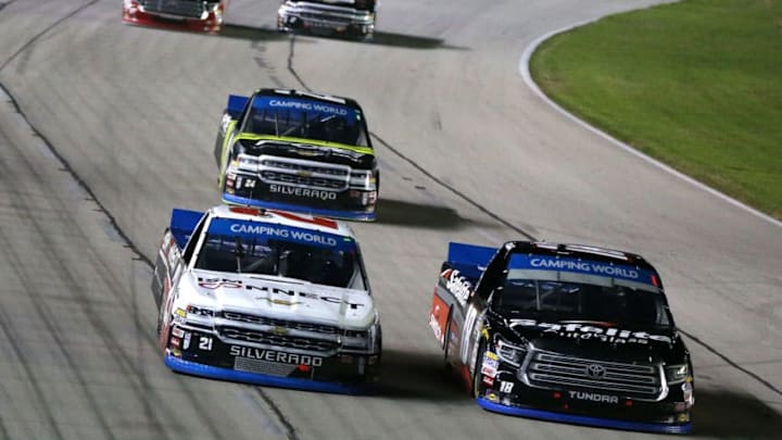 FORT WORTH, TX - NOVEMBER 02: Noah Gragson, driver of the #18 Safelite AutoGlass Toyota, leads Johnny Sauter, driver of the #21 ISM Connect Chevrolet, during the NASCAR Camping World Truck Series JAG Metals 350 at Texas Motor Speedway on November 2, 2018 in Fort Worth, Texas. (Photo by Matt Sullivan/Getty Images)