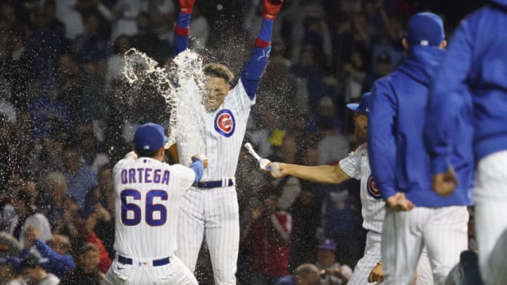 CHICAGO, ILLINOIS - JUNE 01: Christopher Morel #5 of the Chicago Cubs is doused by teammates following a walk-off single in the 10th inning against the Milwaukee Brewers at Wrigley Field on June 01, 2022 in Chicago, Illinois. The Cubs won 4-3. (Photo by Nuccio DiNuzzo/Getty Images)