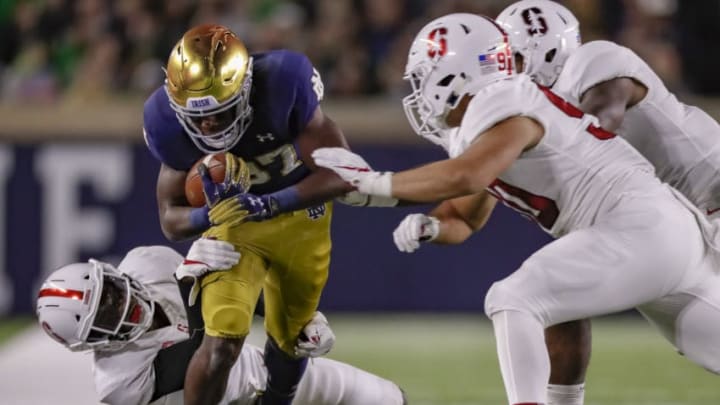 SOUTH BEND, IN - SEPTEMBER 29: Michael Young #87 of the Notre Dame Fighting Irish runs the ball after a reception as Paulson Adebo #11 of the Stanford Cardinal tries to make the stop from behind at Notre Dame Stadium on September 29, 2018 in South Bend, Indiana. (Photo by Michael Hickey/Getty Images)