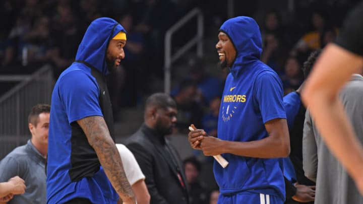 SAN JOSE, CA - OCTOBER 12: DeMarcus Cousins #0 and Kevin Durant #35 of the Golden State Warriors talk during a pre-season game against the Los Angeles Lakers on October 12, 2018 at the SAP Center in San Jose, California. NOTE TO USER: User expressly acknowledges and agrees that, by downloading and/or using this Photograph, user is consenting to the terms and conditions of the Getty Images License Agreement. Mandatory Copyright Notice: Copyright 2018 NBAE (Photo by Andrew D. Bernstein/NBAE via Getty Images)