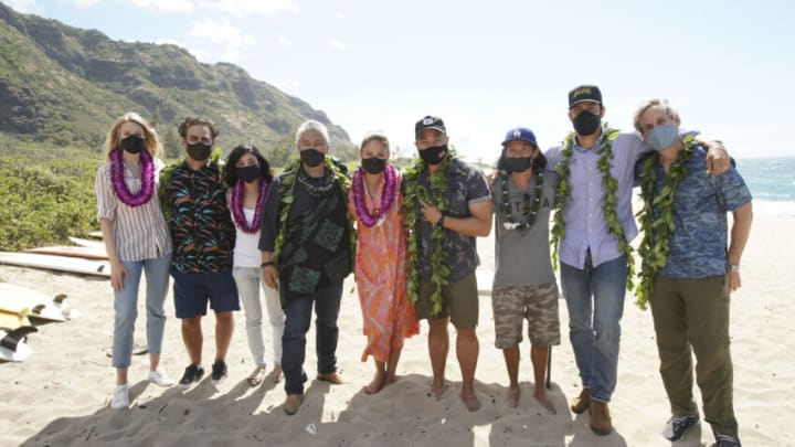 NCIS: HAWAIʹI kicked off its first season production at Mokulē‘ia Beach on Oahu with a traditional Hawaiian blessing in honor of its host Hawaiian culture, which was held in line with the series’ overall filming safety protocols. Series stars Vanessa Lachey, Noah Mills, Jason Antoon, Yasmine Al-Bustami and Tori Anderson, as well as the producers and the NCIS: HAWAIʹI crew, participated. Kahu (Officiant) Kordell Kekoa officiated the ceremony, which included traditional royal maile leis, Oli Aloha (welcoming chant), and Pule Ho’oku’u (closing prayer). In honor of the show’s premiere season, the ceremony centered on the constant motion of the ocean and how the moving ocean waters, driven by the winds and tides, connects the entire planet. Pictured L-R: Tori Anderson, Jason Antoon, Yasmine Al-Bustami, Kahu (Officiant) Ramsey Taum presides over the blessing ceremony, Vanessa Lachey, Executive Producer / Director Larry Teng, and Director of Photography Yasu Tanida, Noah Mills, and Co-Executive Producer Tim Andrew Photo: Karen Neal/CBS ©2021 CBS Broadcasting, Inc. All Rights Reserved.
