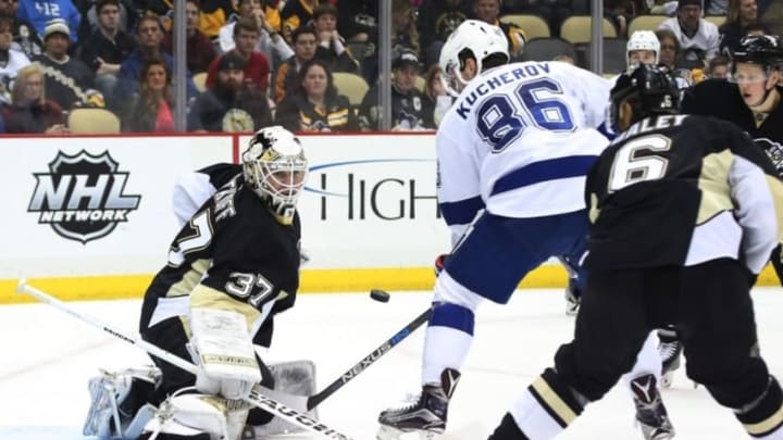 Feb 20, 2016; Pittsburgh, PA, USA; Pittsburgh Penguins goalie Jeff Zatkoff (37) makes a save against Tampa Bay Lightning right wing Nikita Kucherov (86) during the third period at the CONSOL Energy Center. Tampa Bay won 4-2. Mandatory Credit: Charles LeClaire-USA TODAY Sports
