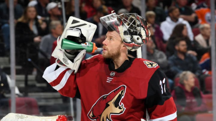 GLENDALE, ARIZONA - FEBRUARY 04: Antti Raanta #32 of the Arizona Coyotes gets a drink during a stop in play of a game against the Edmonton Oilers at Gila River Arena on February 04, 2020 in Glendale, Arizona. (Photo by Norm Hall/NHLI via Getty Images)