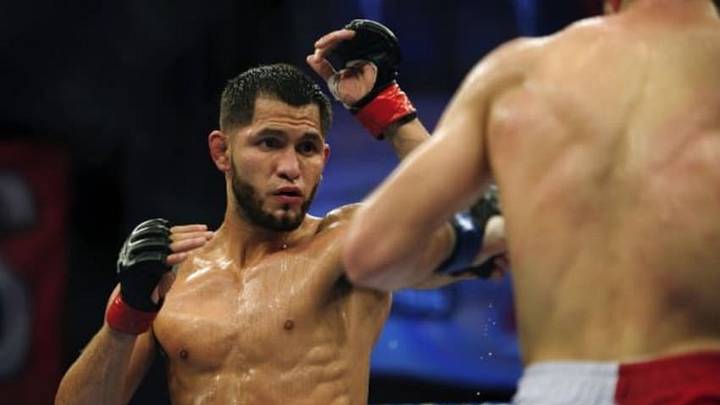 Nov 6, 2013; Fort Campbell, KY, USA; Jorge Masvidal (red gloves) fights Rustam Khabilov (blue gloves) in the lightweight bout during UFC Fight for the Troops at Fort Campbell. Mandatory Credit: Joshua Lindsey-USA TODAY Sports