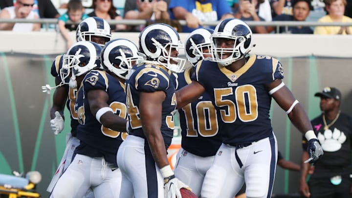 JACKSONVILLE, FL - OCTOBER 15: Malcolm Brown #34 of the Los Angeles Rams celebrates with his teammates after he scored a touchdown after a blocked punt in the first half of their game against the Jacksonville Jaguars at EverBank Field on October 15, 2017 in Jacksonville, Florida. (Photo by Logan Bowles/Getty Images)