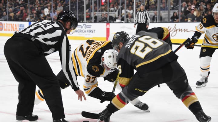 LAS VEGAS, NEVADA - OCTOBER 08: Paul Stastny #26 of the Vegas Golden Knights faces off with Patrice Bergeron #37 of the Boston Bruins during the second period at T-Mobile Arena on October 08, 2019 in Las Vegas, Nevada. (Photo by David Becker/NHLI via Getty Images)