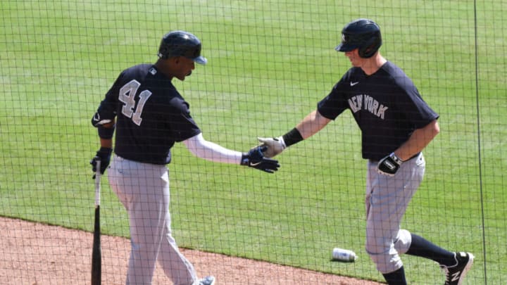 Mar 2, 2021; Sarasota, Florida, USA; New York Yankees infielder Miguel Andujar (41) greets New York Yankees infielder DJ LeMahieu (26) after he scores a run in the first inning against the Baltimore Orioles during spring training at Ed Smith Stadium. Mandatory Credit: Jonathan Dyer-USA TODAY Sports