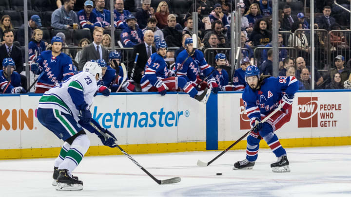 New York Rangers Center Mika Zibanejad (93) takes the puck into the Canucks zone