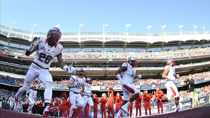Dec 28, 2013; Bronx, NY, USA; Rutgers Scarlet Knights players take the field against the Notre Dame Fighting Irish before the first half of the Pinstripe Bowl at Yankees Stadium. Notre Dame Fighting Irish won the game 29-16. Mandatory Credit: Joe Camporeale-USA TODAY Sports