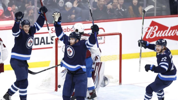 Apr 24, 2022; Winnipeg, Manitoba, CAN; Winnipeg Jets center Adam Lowry (17) celebrates his third period goal against the Colorado Avalanche at Canada Life Centre. Mandatory Credit: James Carey Lauder-USA TODAY Sports