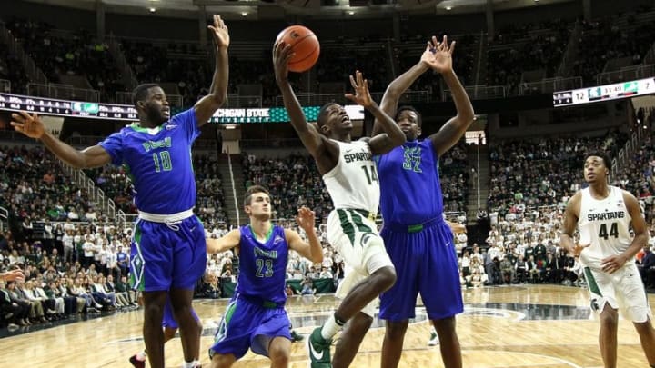 Nov 20, 2016; East Lansing, MI, USA; Michigan State Spartans guard Eron Harris (14) drives to the basket against Florida Gulf Coast Eagles forward Antravious Simmons (32) during the second half of a game at Jack Breslin Student Events Center. Mandatory Credit: Mike Carter-USA TODAY Sports