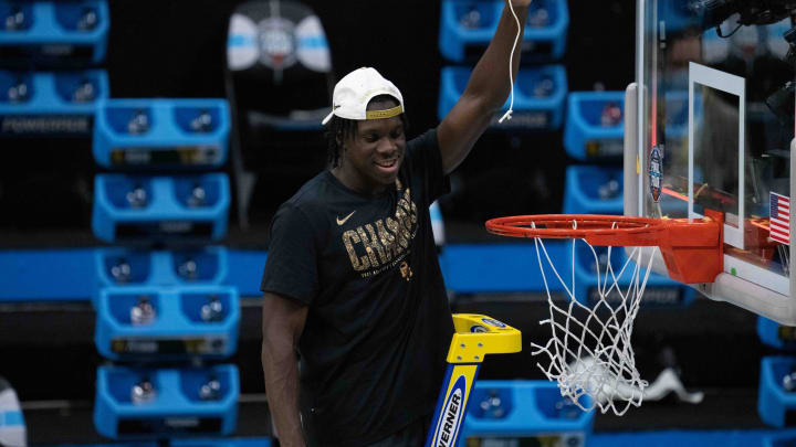 April 5, 2021; Indianapolis, IN, USA; Baylor Bears forward Dain Dainja (42) cuts the net after the national championship game in the Final Four of the 2021 NCAA Tournament against the Gonzaga Bulldogs at Lucas Oil Stadium. Mandatory Credit: Kyle Terada-USA TODAY Sports