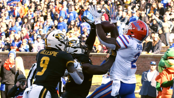 COLUMBIA, MISSOURI – NOVEMBER 16: Running back Lamical Perine #2 of the Florida Gators catches a touchdown pass against safety Tyree Gillespie #9 and linebacker Nick Bolton #32 of the Missouri Tigers in the third quarter at Faurot Field/Memorial Stadium on November 16, 2019 in Columbia, Missouri. (Photo by Ed Zurga/Getty Images)
