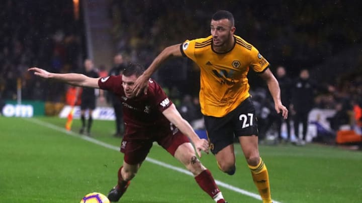 WOLVERHAMPTON, ENGLAND - DECEMBER 21: Romain Saiss of Wolverhampton Wanderers moves away from James Milner during the Premier League match between Wolverhampton Wanderers and Liverpool FC at Molineux on December 21, 2018 in Wolverhampton, United Kingdom. (Photo by David Rogers/Getty Images)