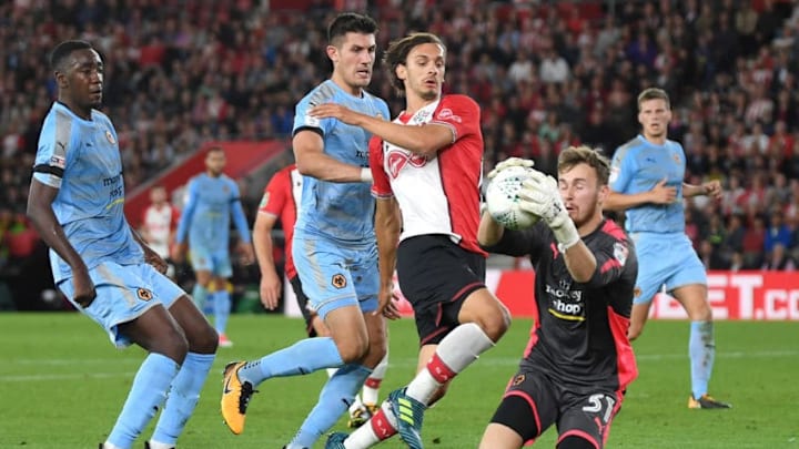 SOUTHAMPTON, ENGLAND - AUGUST 23: Will Norris of Wolverhampton Wanderers saves from Manolo Gabbiadini of Southampton during the Carabao Cup Second Round match between Southampton and Wolverhampton Wanderers at St Mary's Stadium on August 23, 2017 in Southampton, England. (Photo by Mike Hewitt/Getty Images)